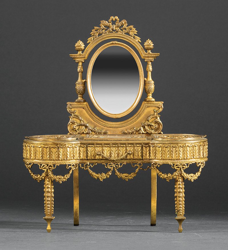 French Miniature Gilt Bronze Dressing Table: A French Miniature Gilt Bronze Dressing Table, late 19th c., with an oval signed portrait miniature inset in the top and en verso of mirror, the fitted frieze drawer, swags, molded legs, height 9 in.,