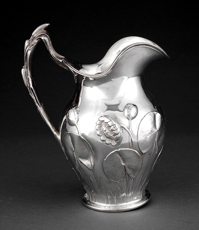 Coin Silver Water Pitcher, Tiffany, Young & Ellis: A John Chandler Moore for Tiffany Young & Ellis Coin Silver Repousse Water Pitcher, New York, NY, c. 1850, marked "TIFFANY, YOUNG & ELLIS/ J.C.M./ 18" Roman capital incuse, baluster form repousse chas