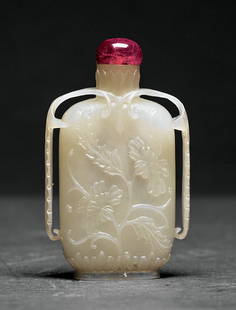 A Chinese White Jade Snuff Bottle: A Chinese White Jade Snuff Bottle, flattened rectangular body with palm leaf handles, carved with flowering branches, stopper, height 2 3/4 in. Provenance: Estate of Aloyis Lee Sonneborn, Mobile, AL