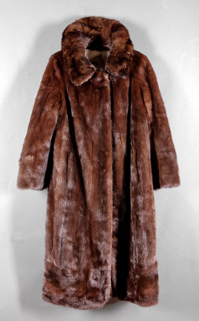 A Dark Brown Mink Coat: A Dark Brown Mink Coat, size 4-6, with notched collar, two pockets, lined in brown silk, back length approx. 45 in