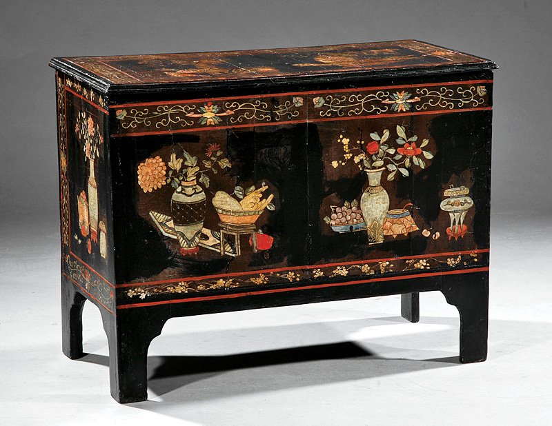 A Lacquer Coffer: An Antique Lacquer Coffer, assembled from Chinese screen panels, hinged cover, bracket feet, polychrome carved and decorated with antiques and precious objects on a black lacquer ground, back unfinish