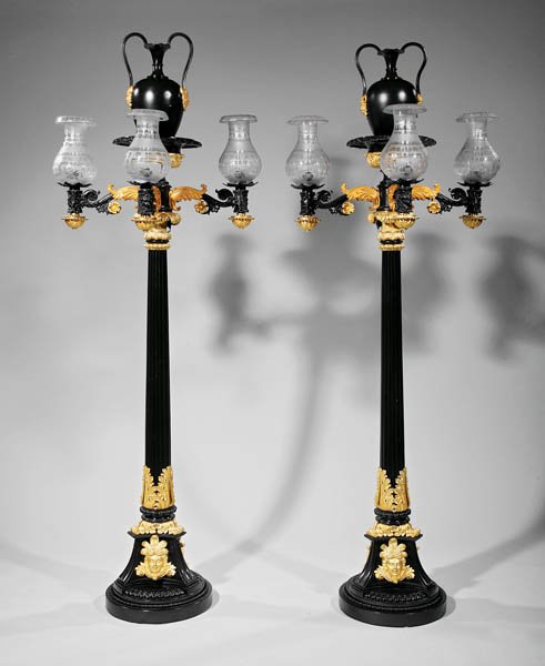Regency Gilt and Patinated Bronze Torchères: A Rare Pair of Monumental Regency Gilt and Patinated Bronze Torchères, early 19th c., amphora fonts with satyr masks, scrolled foliate arms, fluted columnar standards, tripartite feet festooned with