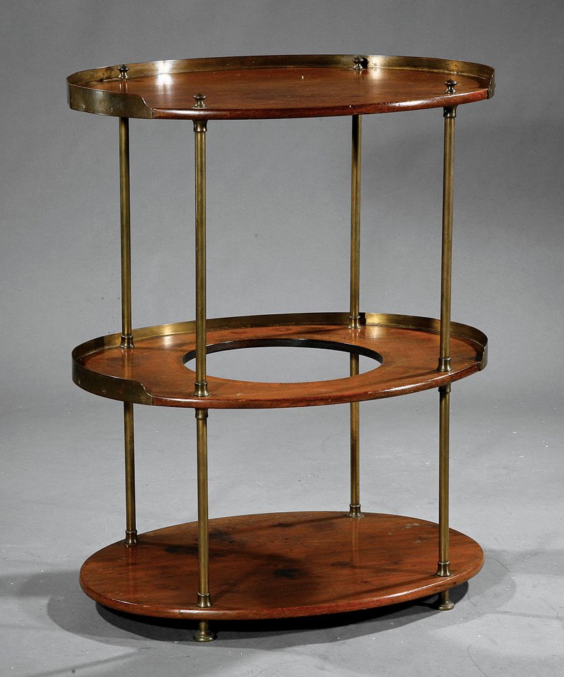 An Edwardian Mahogany and Brass Washstand: An Edwardian Mahogany and Brass Washstand, late 19th c., galleried oval top above cut out medial shelf and conforming stretcher shelf, brass rod supports, ball feet, height 23 1/2 in., width 27 1/2 in