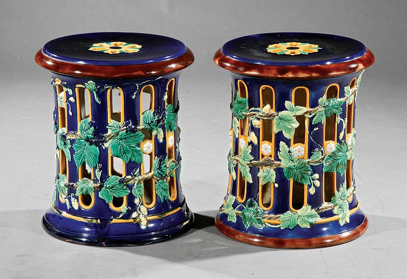 A Pair of Minton-Style Majolica Garden Seats: A Pair of Minton-Style Majolica Garden Seats, late 19th c., barrel form with reticulated arches, fruiting vine decoration, height 17 in., diameter 14 1/2 in