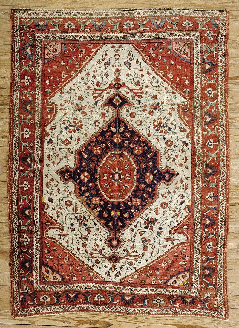 A Caucasian Rug: An Antique Caucasian Rug, light brown ground, geometric floral central medallion, stylized geometric border, 4 ft. 8 in. x 6 ft. 3 in. Provenance: Estate of Aloyis Lee Sonneborn, Mobile, AL