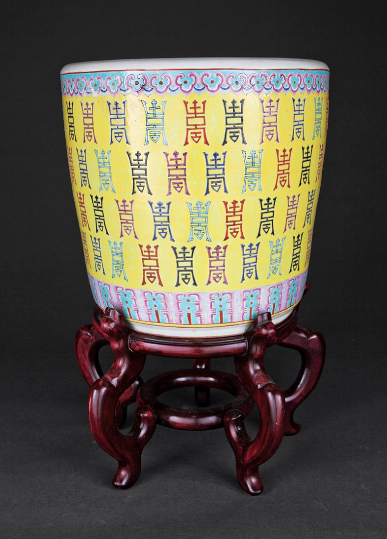 Chinese Famille Jaune Porcelain Jardinieres: A Pair of Chinese Famille Jaune Porcelain Jardinieres, probably mid-20th c., drum-form bodies decorated with a profusion of characters on a lemon yellow ground, height 13 3/4 in., diameter 14 1/4 in. 