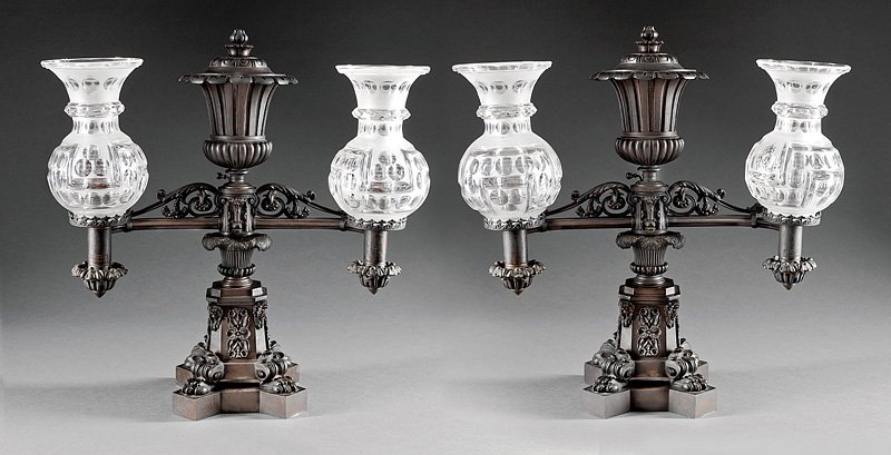 Two-Arm Argand Lamps, attr. Messenger and Sons: A Pair of English Two-Arm Argand Lamps, c. 1830-40, attributed to Thomas Messenger and Sons, burner parts marked "J.I. Cox/New York", fluted urn shaped fonts and standards, perpendicular arms with dec