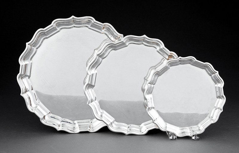 Reed and Barton Sterling Silver Circular Trays: A Suite of Three Reed and Barton Sterling Silver Graduated Circular Trays, "Chippendale" pattern, diameters 12 in., 10 in., and 8 in., combined weight 39 troy ozs. Provenance: Estate of Aloyis Lee Son