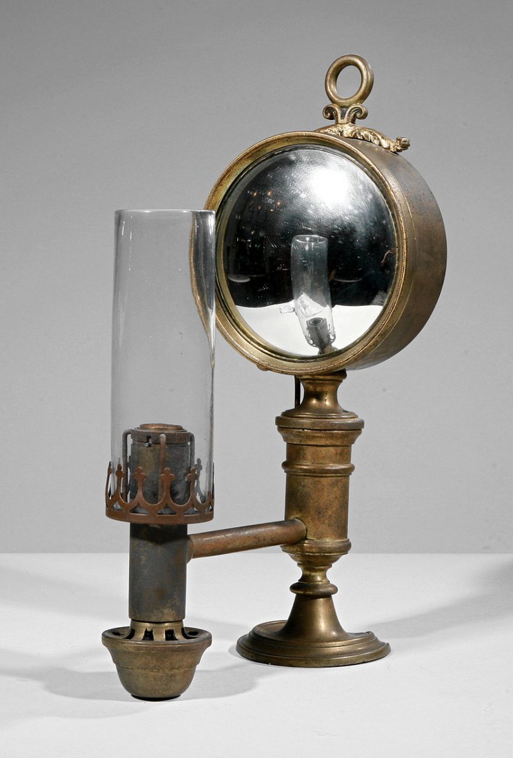 Brass Argand Dual Wall Sconce and Table Lamp: An American Brass Argand Dual Wall Sconce and Table Lamp, mid-19th c., possibly Starr, Fellows and Company, New York, mirrored convex reflector, cylindrical font supporting candlestick form burner, he