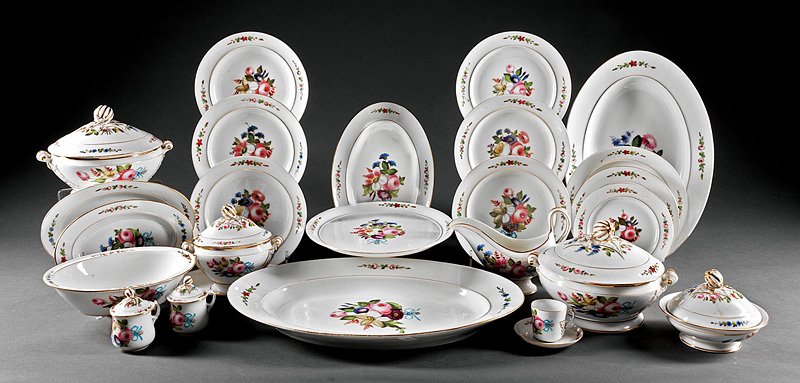 A Paris Porcelain Partial Dinner Service: A Paris Porcelain Partial Dinner Service, c. 1850, polychrome and gilt floral motif, comprising 9 dessert plates, 11 salad plates, 12 dinner plates, 15 soup plates, 7 pots de cremes, 5 graduated servi