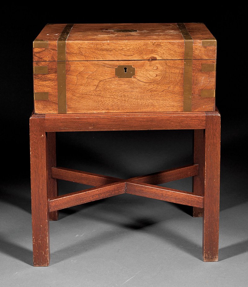 Walnut and Brass-Mounted Lap Desk on Later Stand: A Regency Walnut and Brass-Mounted Lap Desk on Later Stand, early 19th c., strapwork bound lid opening to a fitted interior, stand with X stretcher. Provenance: Estate of Aloyis Lee Sonneborn, Mobile,