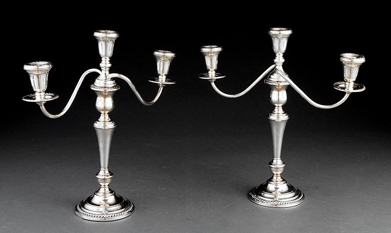 International Sterling Silver Candelabra: A Pair of International Sterling Silver Three-Light Candelabra, with gadroon borders, removable candlearms and weighted bases, height 13 1/4 in., Note: small dents at foot rims. Provenance: Estate of 