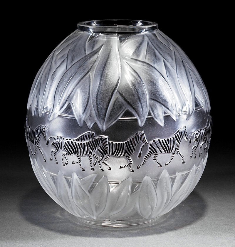 Lalique "Tanzania" Clear and Frosted Glass Vase: Lalique "Tanzania" Clear and Frosted Glass Vase, engraved "Lalique France" and numbered “482”, ovoid body, molded with zebras and leaves, h. 8 1/2 in. Provenance: Estate of Dr. Roger Hatchette, Ne