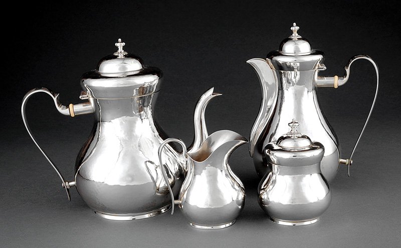 Buccellati Sterling Silver Tea and Coffee Service: Buccellati Sterling Silver Tea and Coffee Service, c. 1930, incl. coffee pot, teapot, covered sugar and covered creamer; plain pyriform bodies, hinged covers on coffee and tea, urn finials, combined w