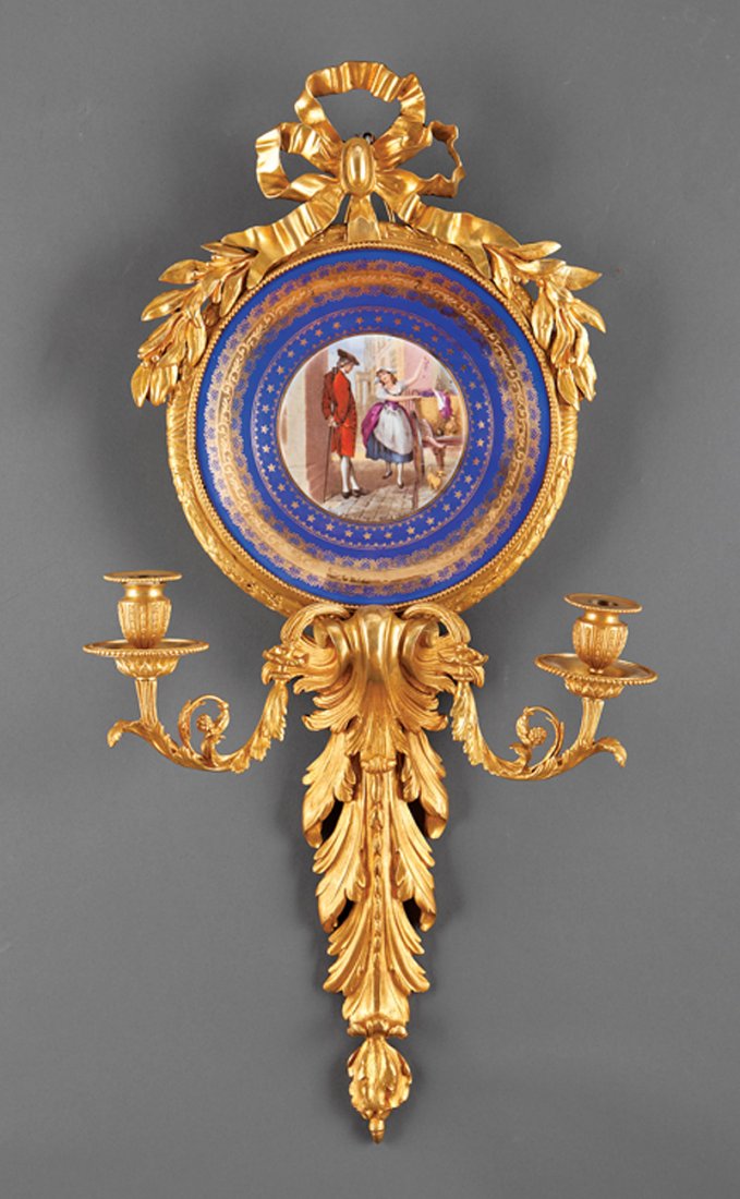 Pair of Louis XVI-Style Porcelain-Mounted Sconces: Pair of Louis XVI-Style Porcelain-Mounted Gilt Bronze Two-Light Sconces, 19th c., ribboned anthemion backplates centering plates painted with street vendor scenes from William Marshall Craig's Cries o