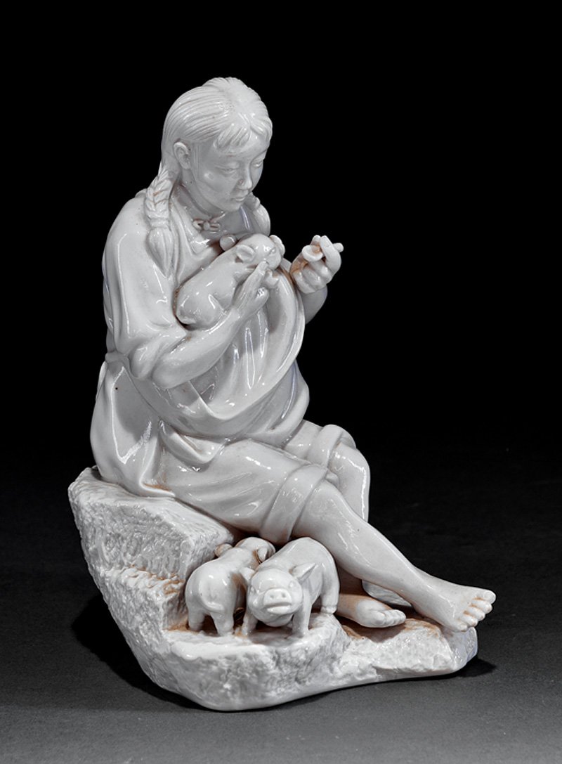 Chinese "Blanc-de-Chine" Porcelain Figural Group: Chinese "Blanc-de-Chine" Porcelain Figural Group, probably mid-20th c., modeled as a Cultural Revolution female seated on a rock feeding a baby pig, h. 8 3/8 in