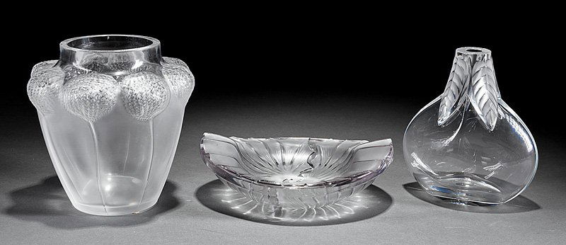 Two Lalique "Bali" and "Osumi" Vases: Two Lalique "Bali" and "Osumi" Clear and Frosted Glass Vases, engraved "Lalique France", first with stylized blooms, h. 7 in.; second with ferns, h. 6 1/2 in.; together with a "Nancy" glass ashtray, h