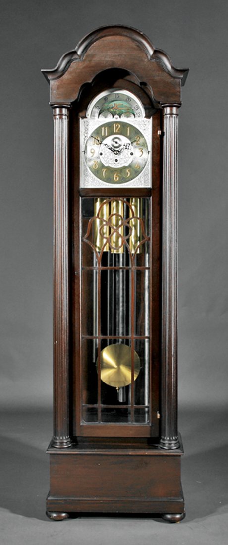 American Mahogany Five-Tube Tall Case Clock: American Carved Mahogany Five-Tube Tall Case Clock, c. 1928, movement marked "Herschede, Cincinnati" with crown, serial # 75511, molded crest, dial with moon phase and engraved foliate design, case fl
