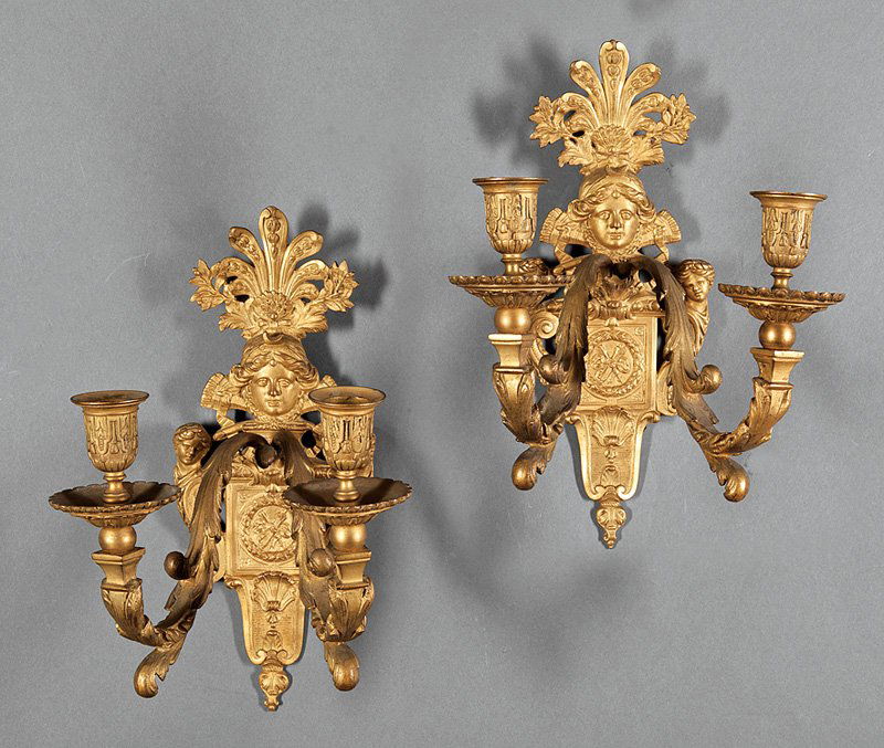 Pair of French Gilt Bronze Two-Light Sconces: Pair of French Gilt Bronze Two-Light Sconces, late 19th c., cartouche backplates flanked by Classical masks, scrolled acanthine arms, h. 14 in., w. 9 3/4 in. Provenance: The Gotlib Collection