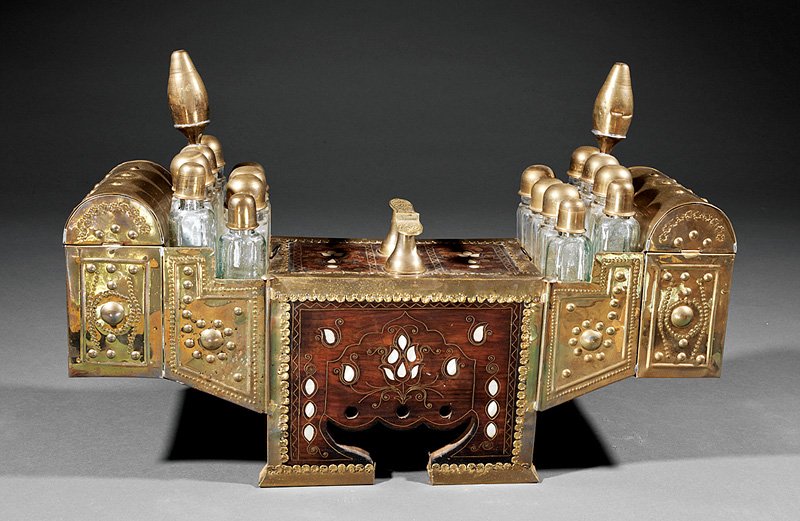 Moroccan Shoe-Shine Stand: Moroccan Inlaid Mother-of-Pearl and Brass-Mounted Mahogany Shoe-Shine Stand, 19th c., central shoe prop, domed compartments, fitted with bottles, drawers in back, retains key, h. 19 in., w. 28 1/2 in.