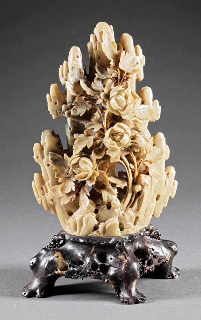 Chinese Green and Black Soapstone Floral Group: Chinese Green and Black Soapstone Floral Group, carved as peonies rising from a rock outcropping, naturalistic footed base, h. 15 3/4 in