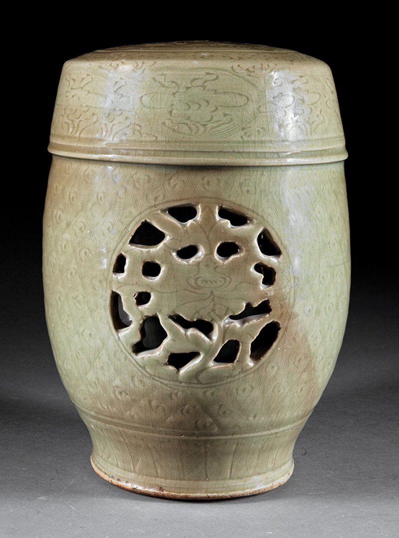 Chinese Celadon Glazed Stoneware Garden Seat: Chinese Celadon Glazed Stoneware Garden Seat, probably Ming Dynasty (1368-1644), barrel-form body with pierced peony panels on incised ground, h. 15 in. Provenance: New Orleans Estate