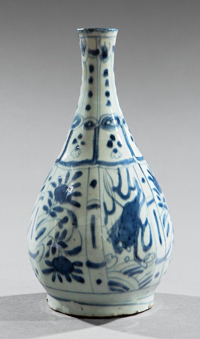 Chinese Blue and White Porcelain Bottle Vase: Chinese Blue and White Porcelain Bottle Vase, probably Ming Dynasty (1368-1644), faceted body decorated with alternating mythical beast and floral panels, "SPB" label, h. 10 1/2 in. Provenance: accomp