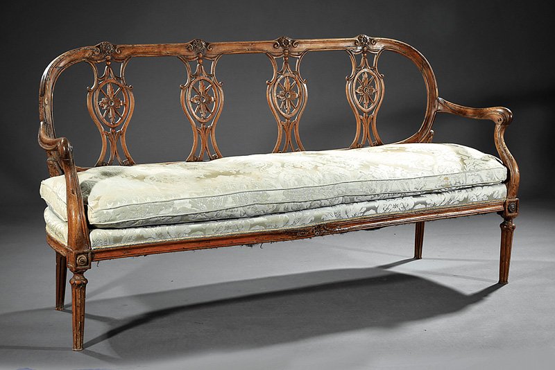Louis XVI Carved Fruitwood Settee: Antique Louis XVI Carved Fruitwood Settee, late 18th c., oval sunflower carved back, vasiform pierced splats, molded scrolled arms, conforming seat rail, bossed fluted tapered legs, h. 35 1/2 in., w. 