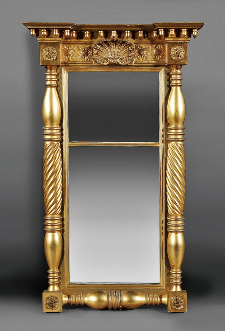 American Classical Carved and Gilded Pier Mirror: American Classical Carved and Gilded Pier Mirror, early 19th c., blocked cornice, acorn pendants, frieze centered by a shell, rosette corner blocks, spiral reeded columns, divided mirror plate, h. 48 