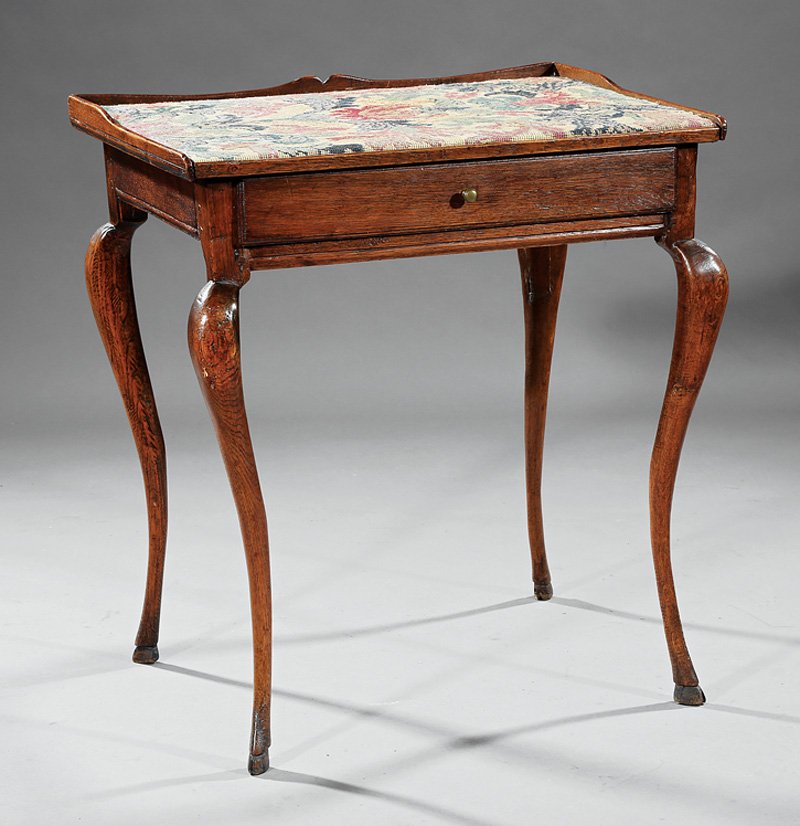Louis XV Carved Oak Side Table: Louis XV Carved Oak Side Table, 18th c., needlepoint top with gallery, frieze drawer, cabriole legs, hoof feet, h. 28 7/8 in., w. 26 in., d. 19 1/2 in Provenance: accompanied by a copy of the Samuel F