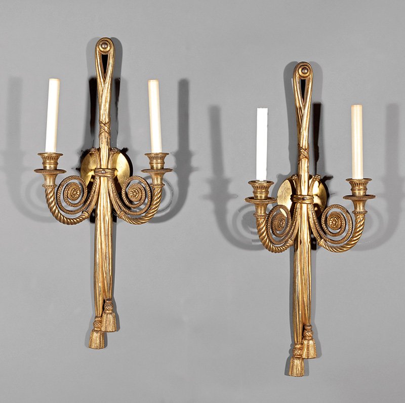 Empire-Style Gilt Bronze Two-Light Sconces: Pair of Empire-Style Gilt Bronze Two-Light Sconces, 19th c., tied tassel backplates, nautilus-form arms, h. 27 1/4 in., w. 10 3/4 in. Provenance: New Orleans Estate