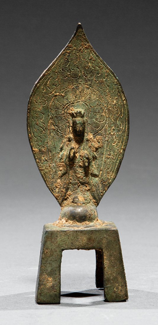 Chinese Inscribed Bronze Votive Figure: Small Chinese Inscribed Bronze Votive Figure, probably Tang Dynasty (618-907) or earlier, modeled with crown and robes standing before a mandorla on mounded base set on inscribed corner-leg square pla