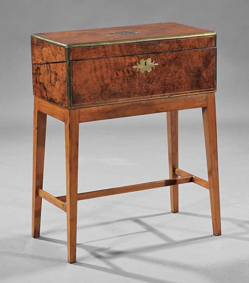William IV Brass-Mounted Burl Walnut Lap Desk: William IV Brass-Mounted Burl Walnut Lap Desk, mid-19th c., well fitted interior with secret compartments, h. 7 1/2 in., w. 19 3/4 in., d. 10 3/8 in., mounted on later tapered leg stand, overall h. 25