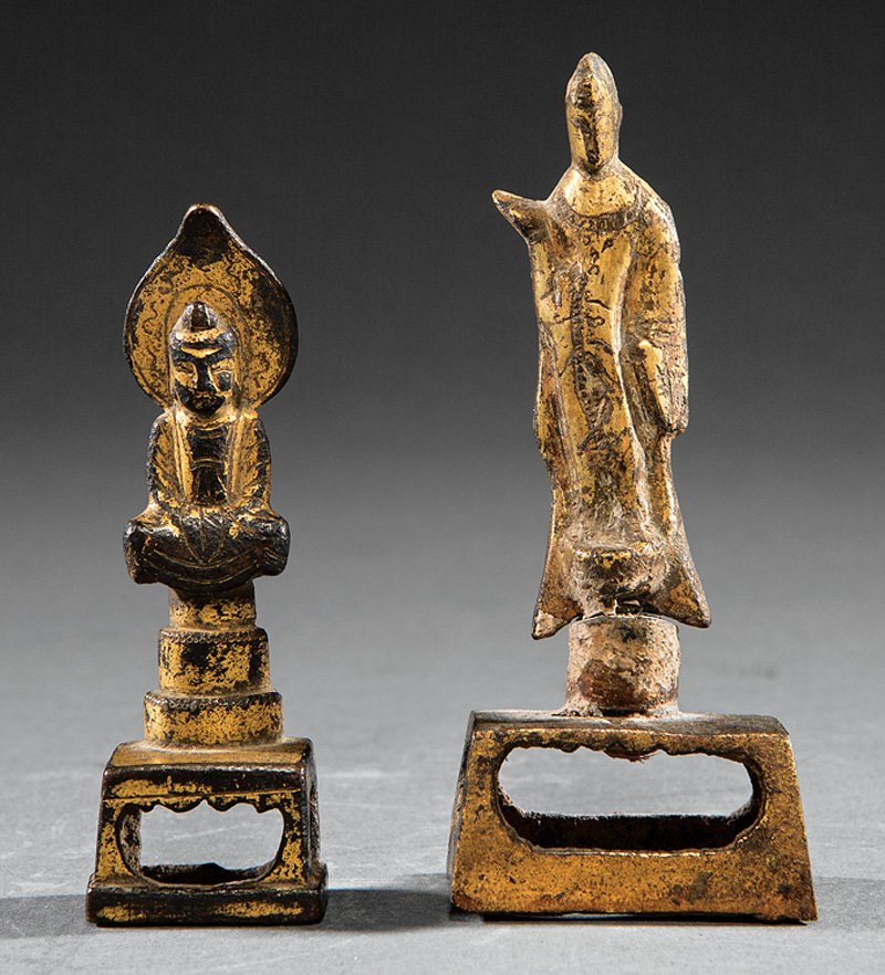 Two Chinese Gilt Bronze Buddhist Figures: Two Small Chinese Gilt Bronze Buddhist Figures, probably Tang Dynasty (618-907), first standing, cylindrical base, pierced rectangular platform, h. 3 7/8 in; second seated before a mandorla, tiered ba