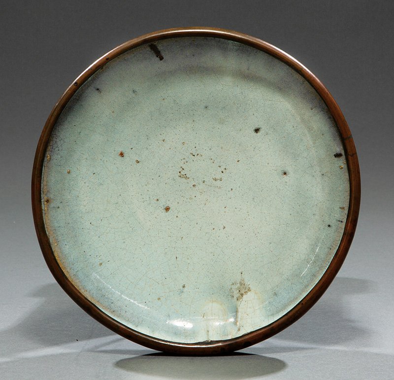 Chinese Junyao Stoneware Dish: Chinese Junyao Stoneware Dish, probably Ming Dynasty (1368-1644) or earlier, mottled sky blue glaze, later brass rim, h. 2 to 2 5/8 in., dia. 10 in. Provenance: New Orleans Estate