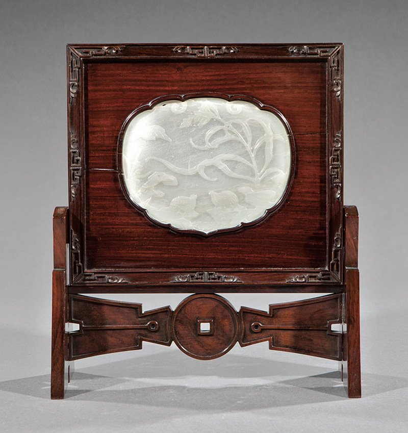Chinese White Jade Inset Table Screen: Chinese White Jade Inset Table Screen, shaped panel relief-carved with quail and millet, h. 4 3/8 in., w. 5 3/8 in., mounted in hardwood stand, overall h. 11 in., w. 9 5/8 in., d. 3 3/4 in.. Provenanc
