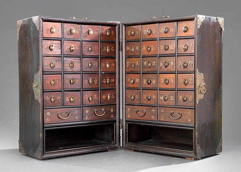 Chinese Hardwood Traveling Apothecary Cabinet: Chinese Brass-Mounted Hardwood Traveling Apothecary Cabinet, probably 20th c., hinged rectangular body opening to reveal 20 short drawers, 2 long drawers, and 2 shelves, h. 20 1/2 in., w. 14 1/2 in., 
