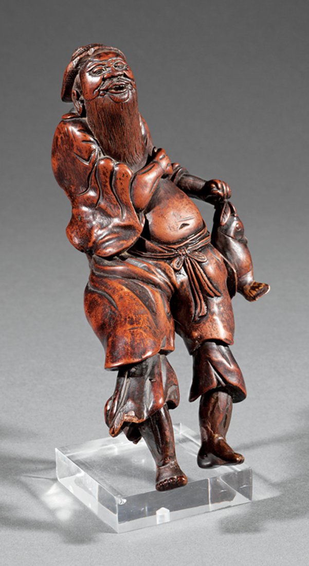 Two Asian Wood Carvings: Two Asian Wood Carvings, probably 20th c., incl. Chinese bamboo brush pot with floral and calligraphy decoration, h. 9 in.; and rootwood carving of a fisherman, h. 8 3/4 in., acrylic stand, overall h.