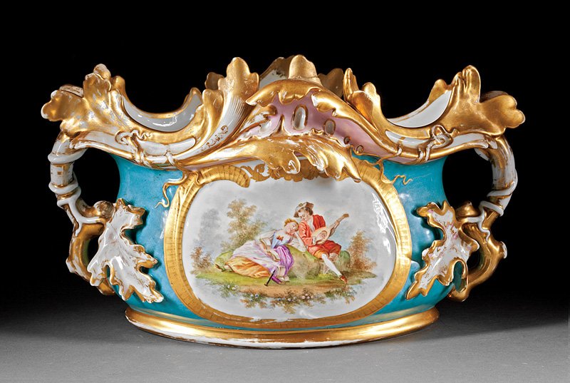 Paris Porcelain Jardinière: Paris Porcelain Jardinière, mid-19th c., waisted oval body with leafy branch handles, reserves with an amorous couple and a floral bouquet, h. 10 1/2 in., w. 18 3/4 in., d. 10 3/4 in. Note: Old resto