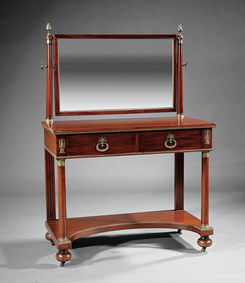 FrenchBronze-Mounted Mahogany Dressing Table: French Empire-Style Bronze-Mounted Mahogany Dressing Table, late 19th/early 20th c., rectangular beveled mirror on tapered supports, frieze drawers over columns, incurvate stretcher shelf, ball feet, 