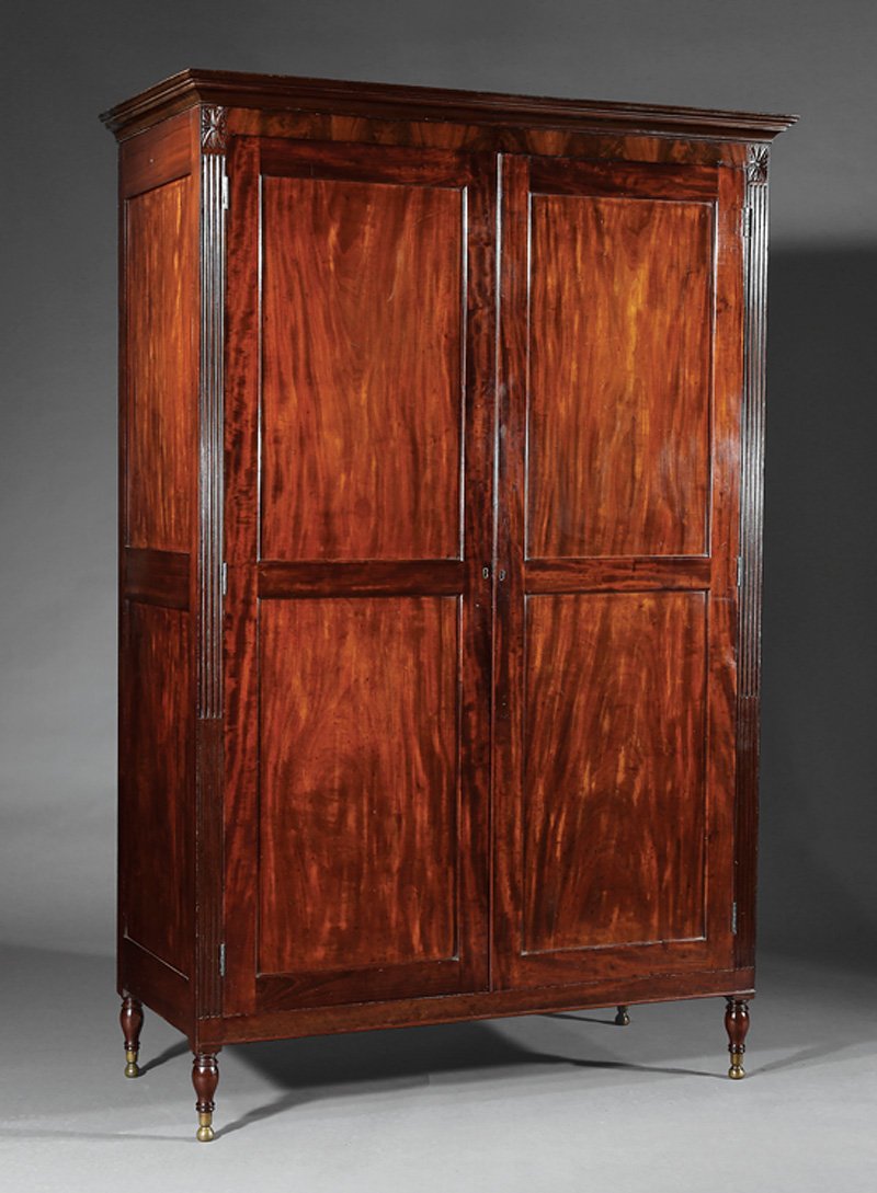Armoire, possibly Duncan Phyfe: American Federal Carved Mahogany Armoire, c. 1800, possibly Duncan Phyfe, NY, cove molded cornice, highly figured paneled doors flanked by fluted stiles, headed by blocked rosettes, shelf interior, mo