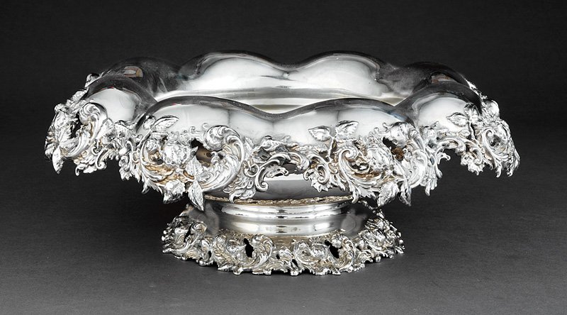 American Sterling Silver Footed Centerbowl, Mauser: American Sterling Silver Footed Centerbowl, Mauser, New York, act. 1887-1903, everted rim with reticulated rose, rose leaf and scroll border, h. 5 5/8 in., dia. 15 in., wt. 72.10 troy ozs. Provenance:
