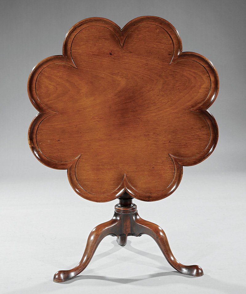 George III Carved Mahogany Supper Table: George III Carved Mahogany Supper Table, late 18th c., dished scalloped tilt-top, vasiform support, arched legs, pad feet, h. 27 1/4 in., w. 35 in., d. 34 1/2 in