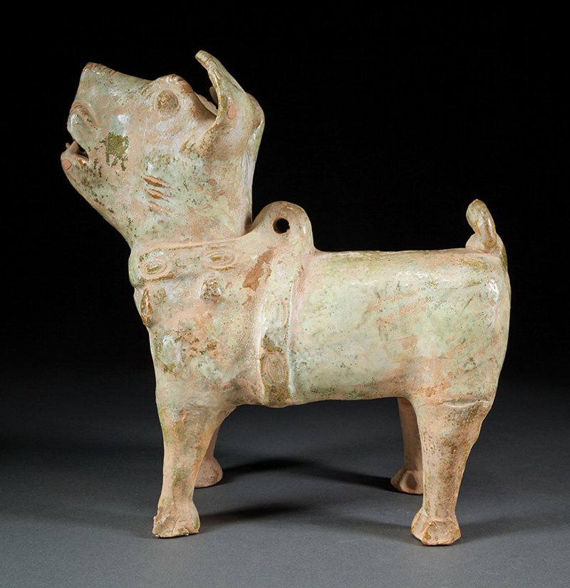 Chinese Green Glazed Pottery Dog: Chinese Green Glazed Pottery Dog, probably Han Dynasty (206 BCE-220 CE), standing foursquare with open-mouthed raised head and pricked ears wearing a harness and collar, overall degraded iridescent gr
