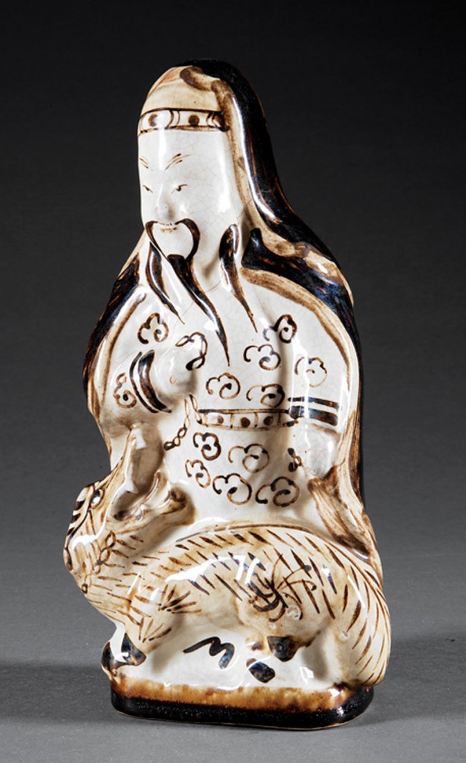 Chinese Cizhou Pottery Figure, probably Ming Dynasty: Chinese Cizhou Pottery Figure, probably Ming Dynasty (1368-1644), male figure modeled seated behind a mythical beast, h. 11 in. Provenance: The Oriental Impression, 1984