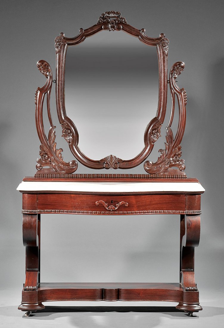 American Rococo Carved Rosewood Dressing Table: American Rococo Carved Rosewood Dressing Table, mid-19th c., probably New Orleans, shield-shaped mirror, scrolled supports, serpentine variegated marble top, conforming frieze drawer, scrolled bracket