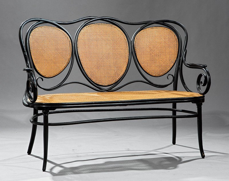 Austrian Ebonized Bentwood Caned Triple Back Settee: Austrian Ebonized Bentwood and Caned Triple Back Settee, late 19th c., Thonet or J. & J. Kohn, scroll arms, incurvate seat rail, flared legs; together with a single armchair with open horseshoe back,