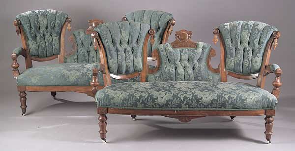 An American Renaissance Walnut Parlour: An American Renaissance Walnut Parlour Suite , c. 1870, in the manner of John Jelliff, Newark, NJ, comprising a pair of settees, two armchairs and six bustle sidechairs, each cresting in a pendant cen