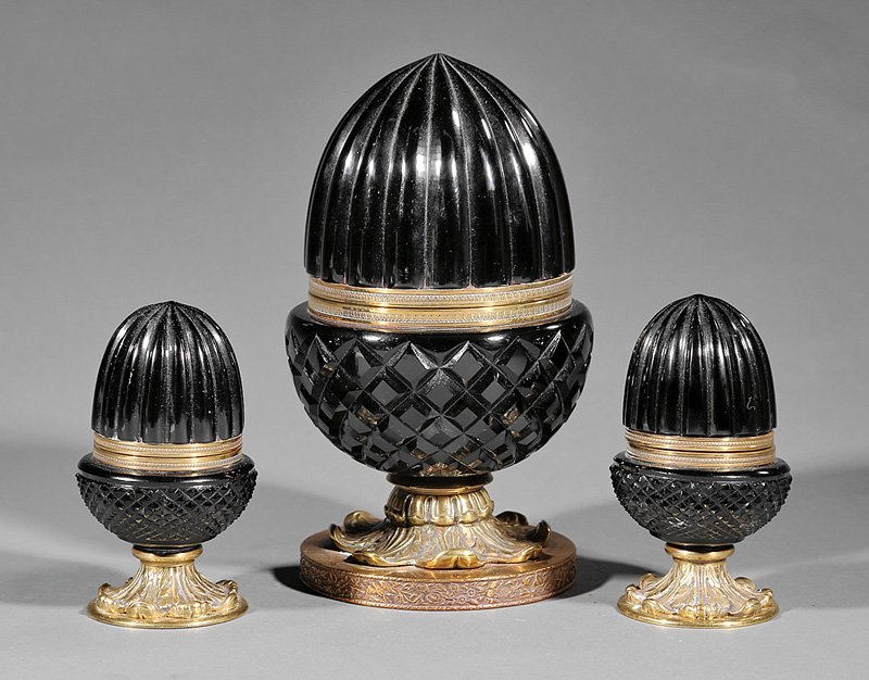 Gilt Brass-Mounted Black Opaline Glass Boxes: Three French Gilt Brass-Mounted Black Opaline Glass Boxes, 19th/20th c., acorn-form with foliate bases, h. 5 in. and 8 1/2 in. Provenance: Sallea Antiques, New Canaan, CT