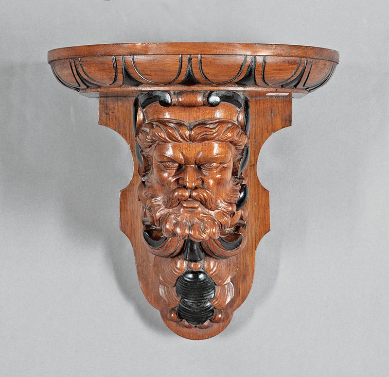 Ebonized and Carved Walnut Wall Bracket: American Renaissance Ebonized and Carved Walnut Wall Bracket, mid-19th c., in the manner of John Jelliff, finely carved male bust, demilune top with egg-and-dart motif, h. 10 1/2 in., w. 10 in., d. 8